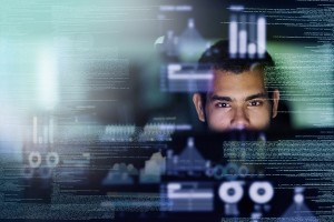 Cropped shot of a young computer programmer looking through data