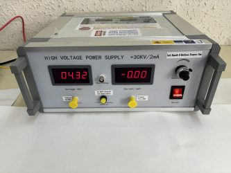 High voltage power supply for polarizing